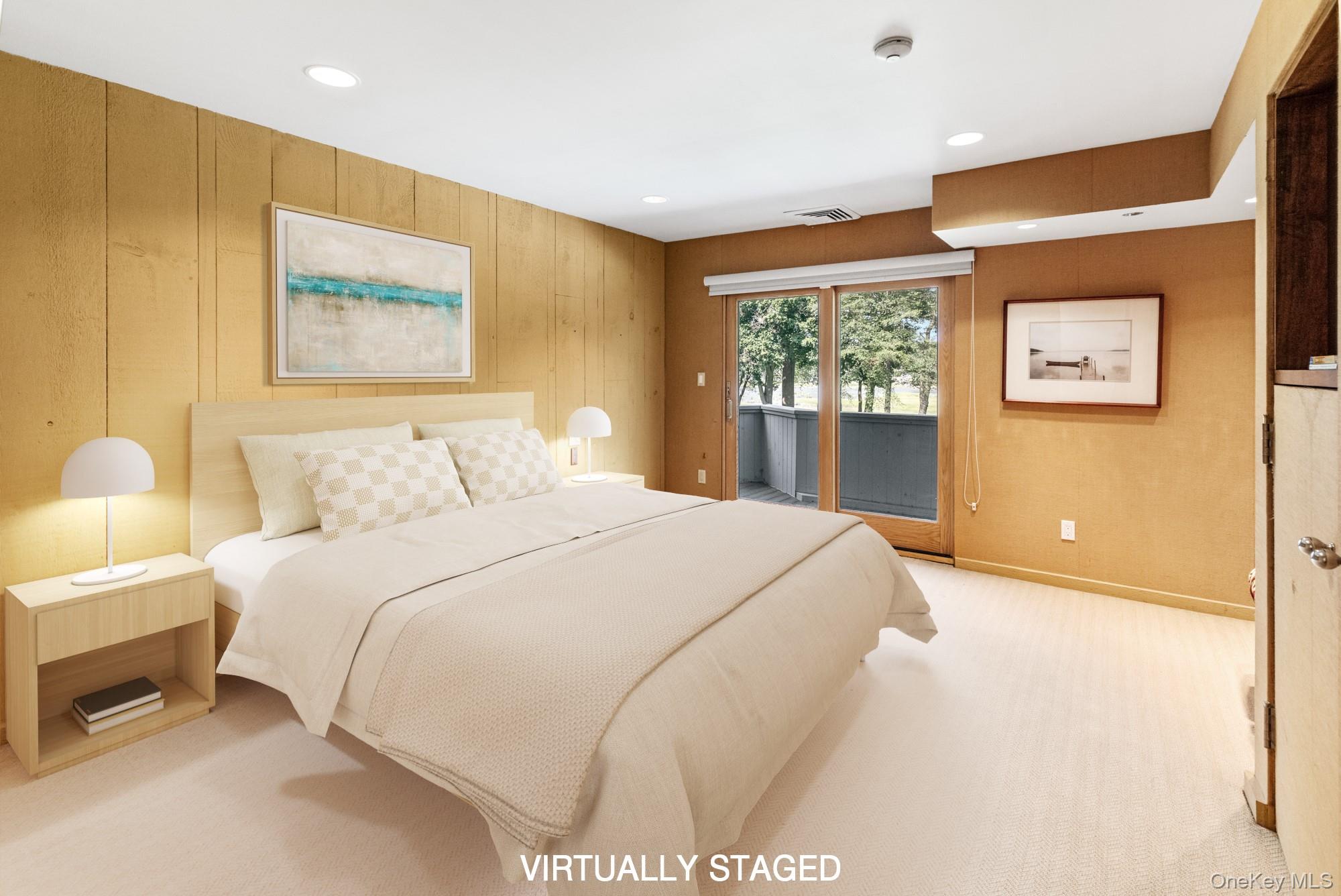 8 Mill Pond Lane Locust Valley, NY 11560 - Photo 23 of 38 a bedroom with a bed and a painting on the wall