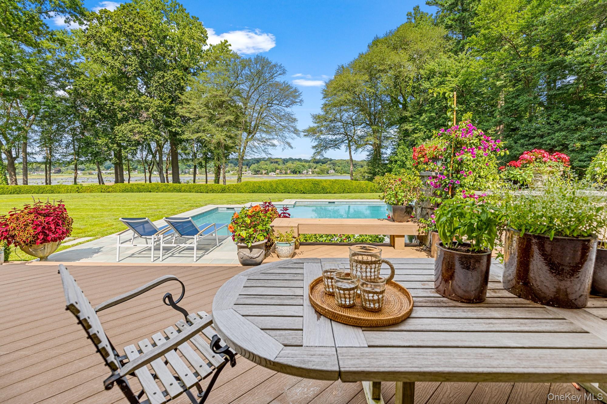 8 Mill Pond Lane Locust Valley, NY 11560 - Photo 30 of 38 a view of a table and chairs in the patio