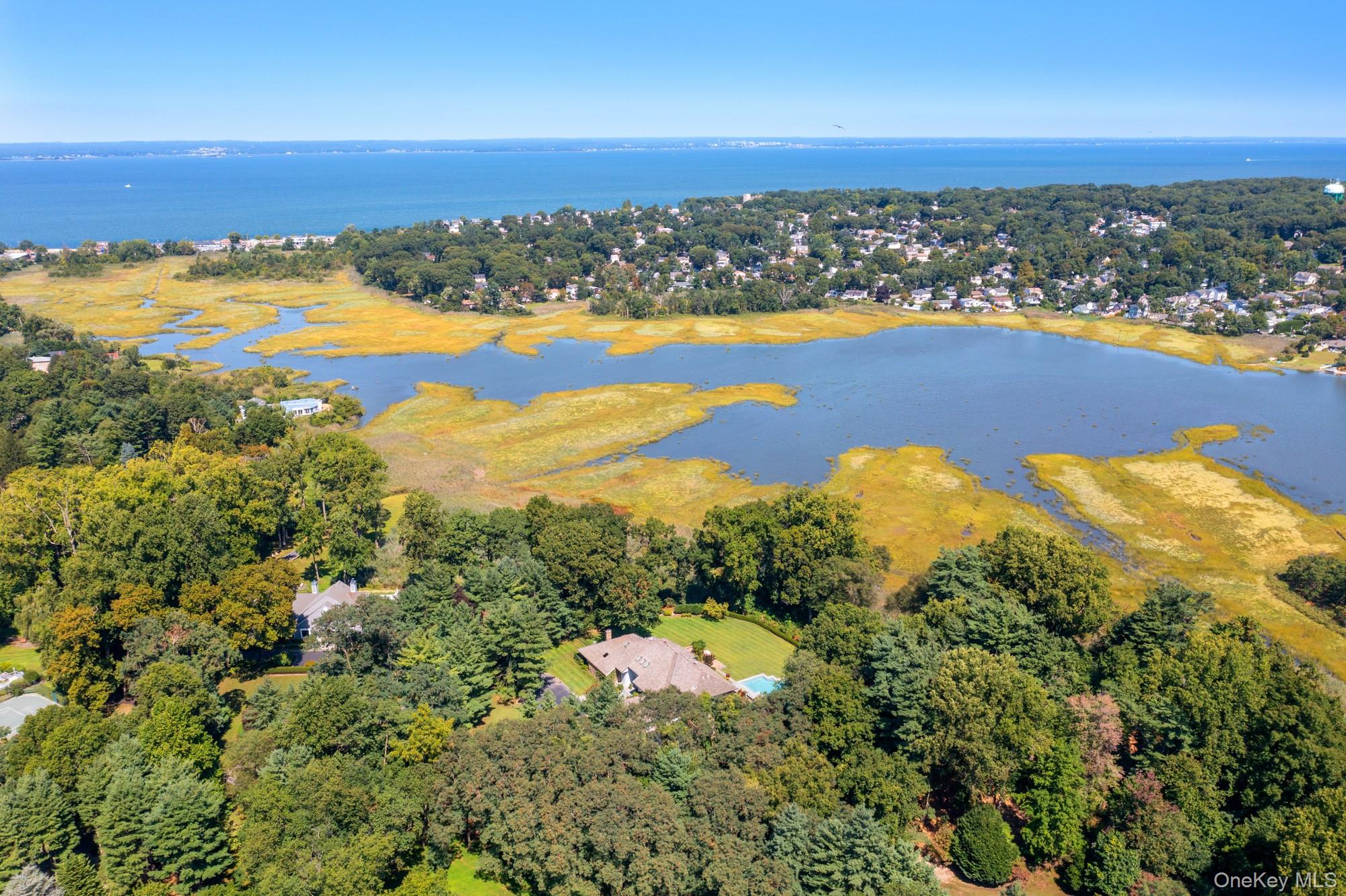 8 Mill Pond Lane Locust Valley, NY 11560 - Photo 38 of 38 an aerial view of ocean and residential houses with outdoor space