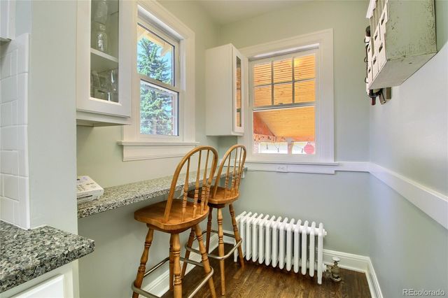 a balcony with table and chairs