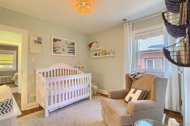 a bedroom with furniture and a window