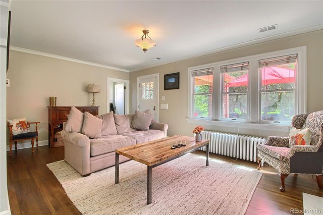a living room with furniture and windows