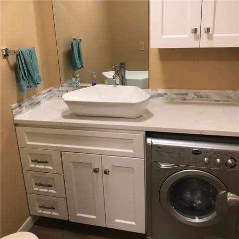 a bathroom with a sink and a mirror