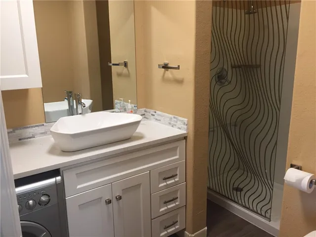 a bathroom with a sink and a mirror