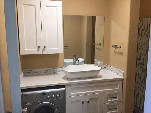 a bathroom with a sink and a mirror