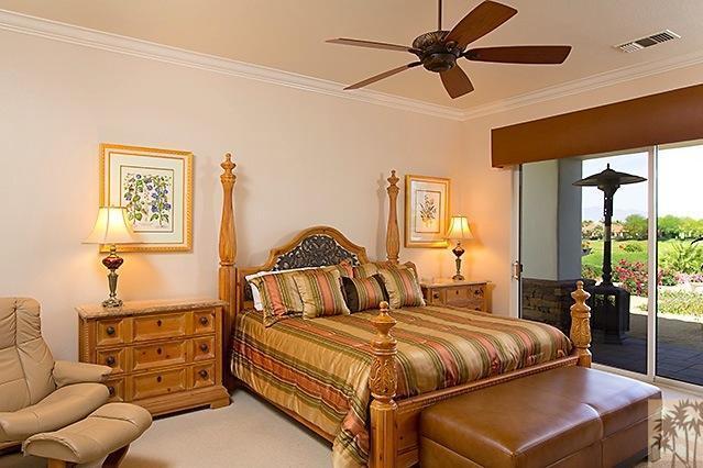 152 Loch Lomond Road Rancho Mirage, CA 92270 - Photo 11 of 26 a bedroom with a bed couch and window