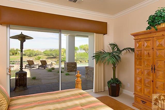 152 Loch Lomond Road Rancho Mirage, CA 92270 - Photo 12 of 26 a bedroom with a bed and a potted plant