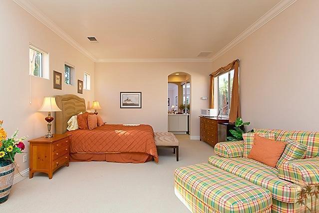 152 Loch Lomond Road Rancho Mirage, CA 92270 - Photo 15 of 26 a bedroom with furniture and a potted plant
