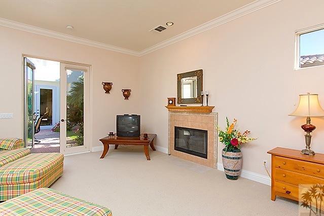 152 Loch Lomond Road Rancho Mirage, CA 92270 - Photo 16 of 26 a living room with furniture and a fireplace