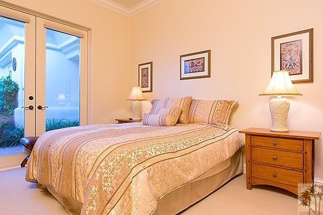 152 Loch Lomond Road Rancho Mirage, CA 92270 - Photo 17 of 26 a bedroom with a bed and a window