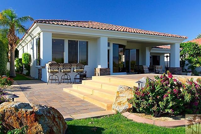 152 Loch Lomond Road Rancho Mirage, CA 92270 - Photo 18 of 26 a view of a house with potted plants and a chair