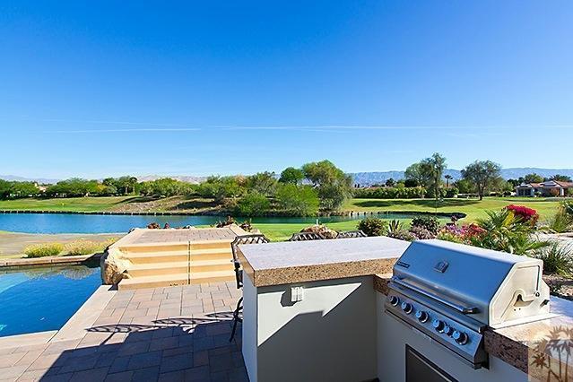 152 Loch Lomond Road Rancho Mirage, CA 92270 - Photo 20 of 26 a view of a patio with swimming pool and outdoor seating