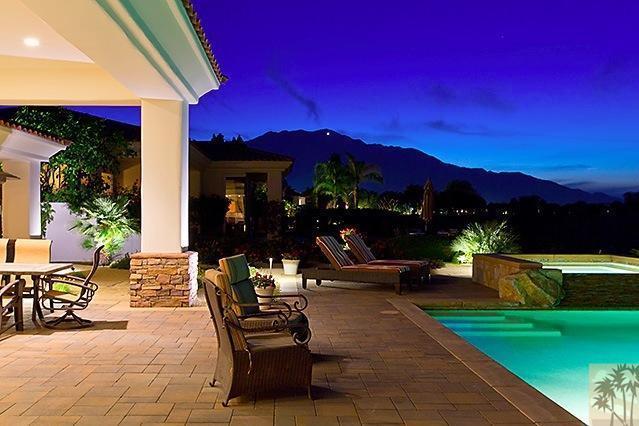 152 Loch Lomond Road Rancho Mirage, CA 92270 - Photo 22 of 26 a view of a house with patio swimming pool and a yard