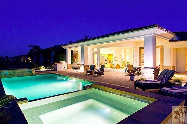 152 Loch Lomond Road Rancho Mirage, CA 92270 - Photo 26 of 26 a view of a swimming pool with chairs in patio