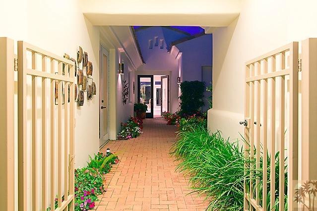 152 Loch Lomond Road Rancho Mirage, CA 92270 - Photo 4 of 26 a front view of a house with a yard