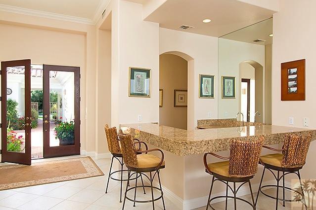152 Loch Lomond Road Rancho Mirage, CA 92270 - Photo 5 of 26 a dining room with furniture and wooden floor