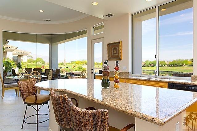 152 Loch Lomond Road Rancho Mirage, CA 92270 - Photo 8 of 26 a dining room with furniture and a large window