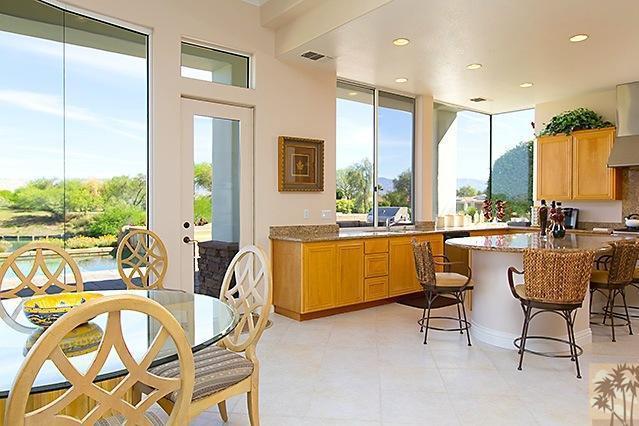 152 Loch Lomond Road Rancho Mirage, CA 92270 - Photo 9 of 26 a view of a dining room with furniture and a large window