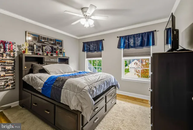 a bedroom with a large bed and a window