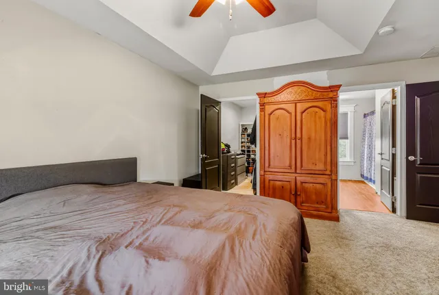 a bedroom with a bed and a closet