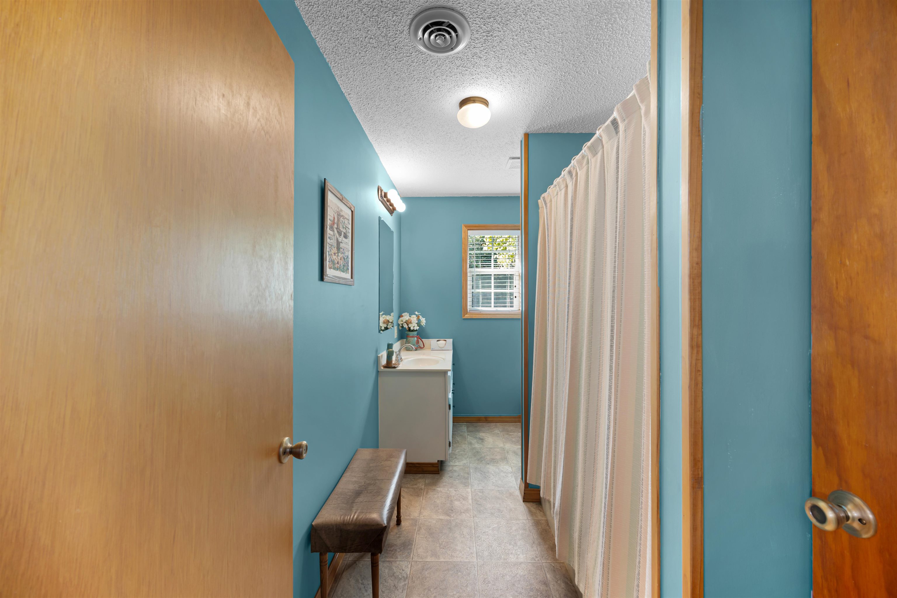 61 Cr 303 Road Iuka, MS 38852 - Photo 14 of 19 Bathroom with vanity and a textured ceiling