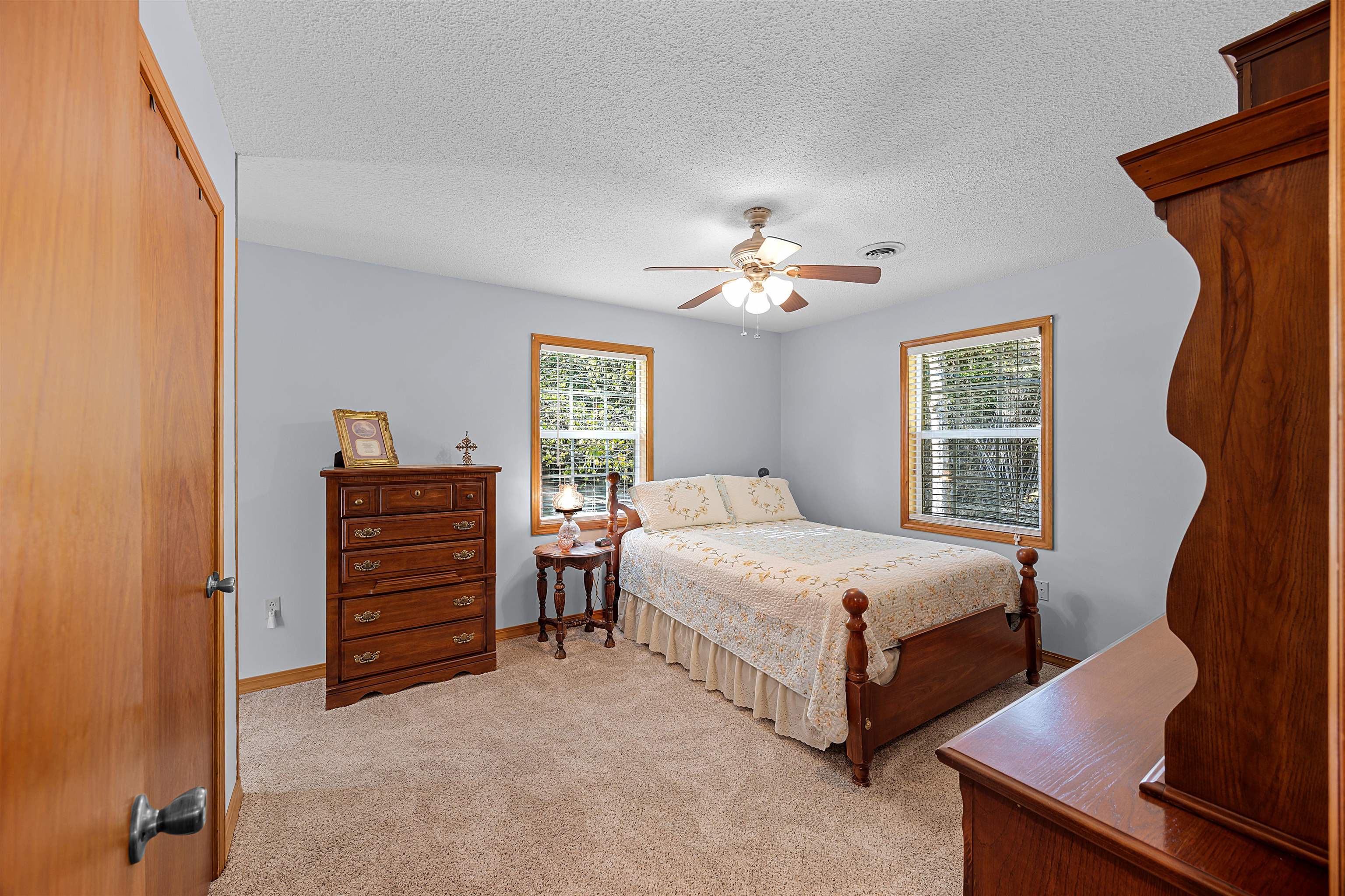 61 Cr 303 Road Iuka, MS 38852 - Photo 15 of 19 Carpeted bedroom featuring a textured ceiling, a closet, and ceiling fan