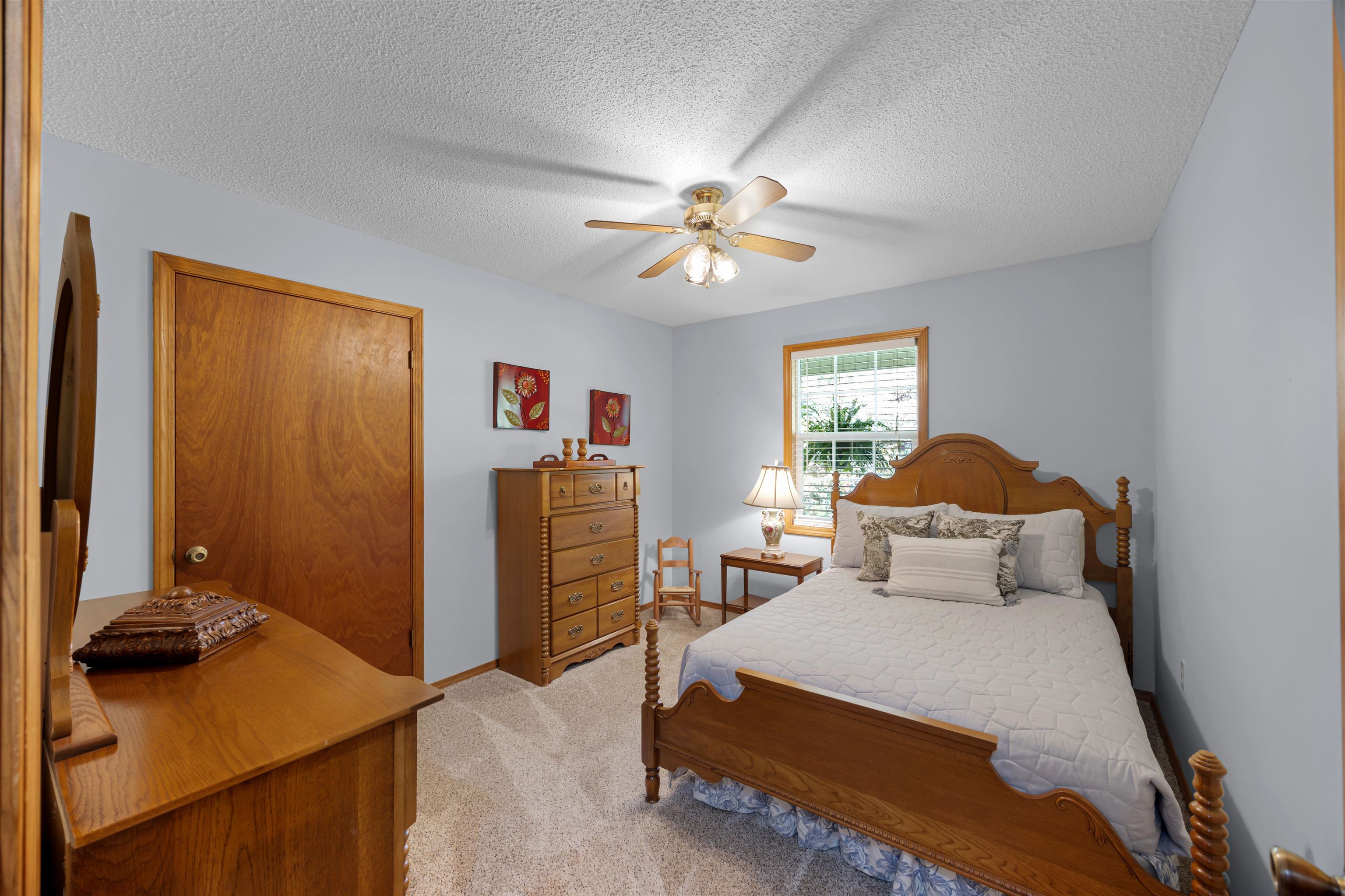 61 Cr 303 Road Iuka, MS 38852 - Photo 18 of 19 Bedroom with a closet, ceiling fan, a textured ceiling, and light colored carpet