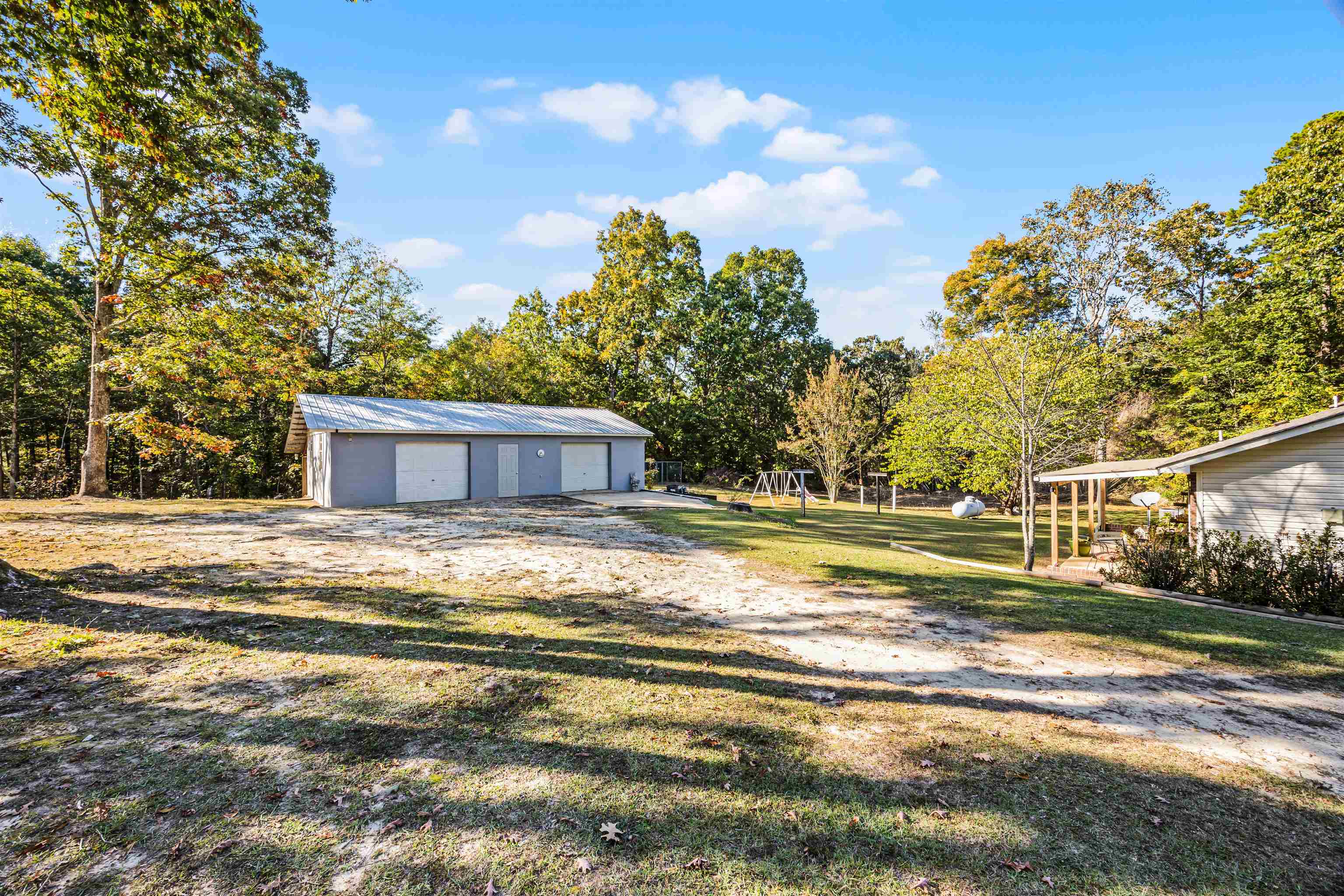 61 Cr 303 Road Iuka, MS 38852 - Photo 4 of 19 View of yard featuring an outbuilding and a garage