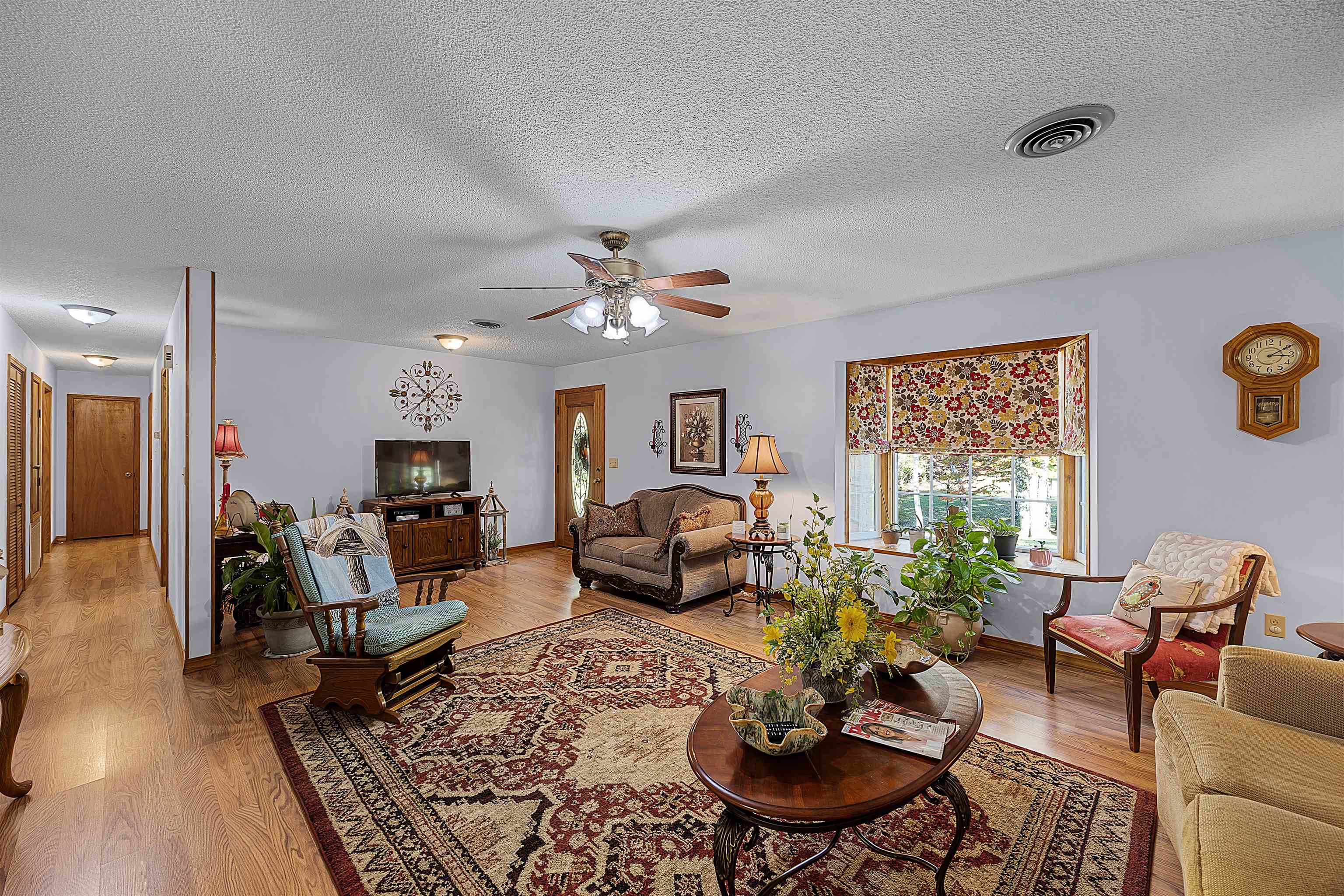 61 Cr 303 Road Iuka, MS 38852 - Photo 6 of 19 Living room with light hardwood / wood-style floors, a textured ceiling, and ceiling fan
