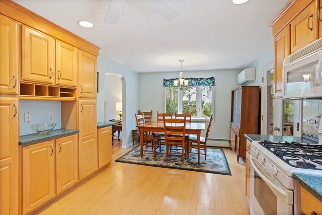 a kitchen with stainless steel appliances granite countertop a stove and a refrigerator