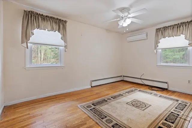 a view of room with window and hardwood floor