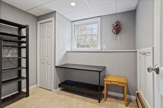 a hallway that has a bench in it