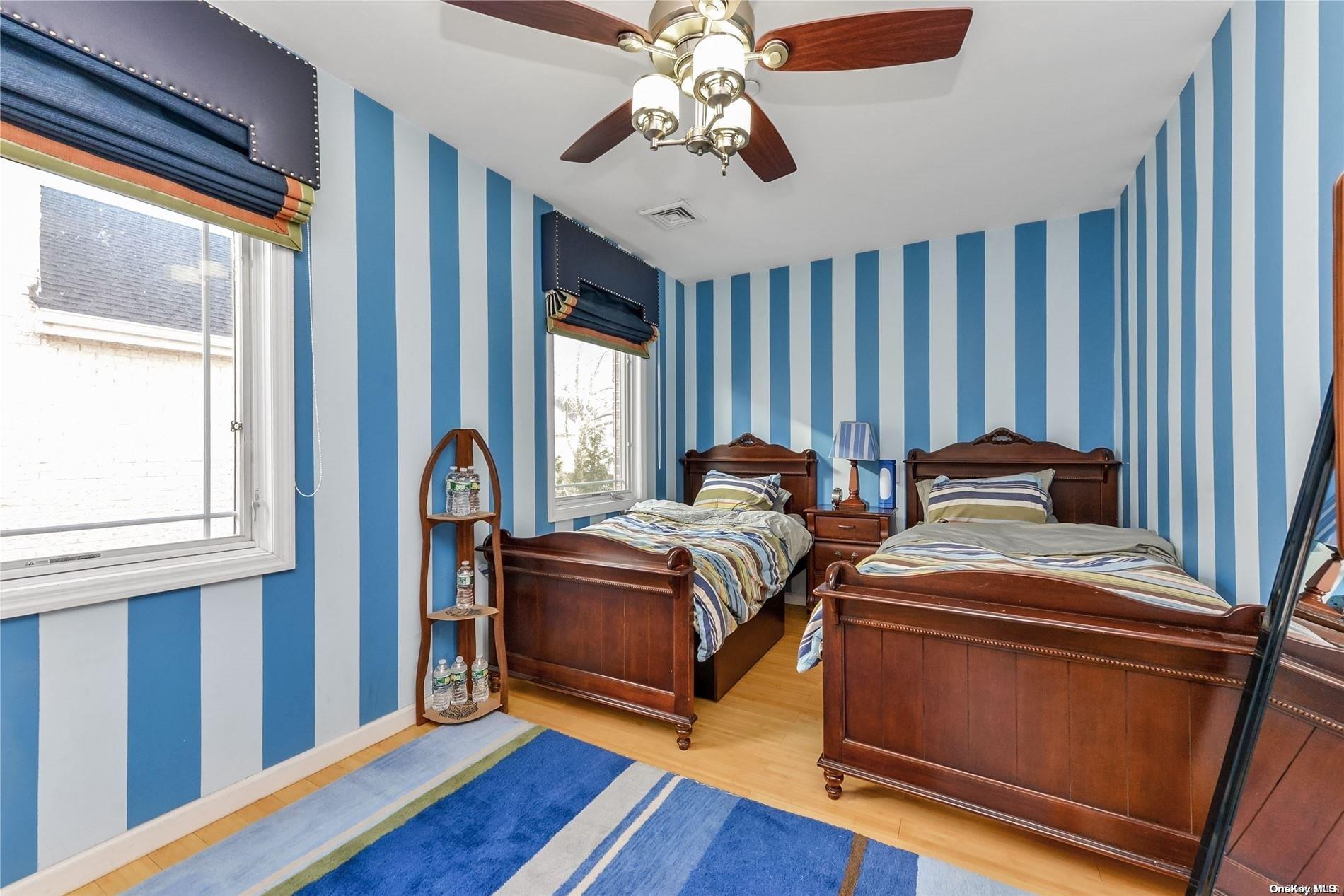 147-32 69th Road Queens, NY 11367 - Photo 12 of 24 a bed room with bed and window