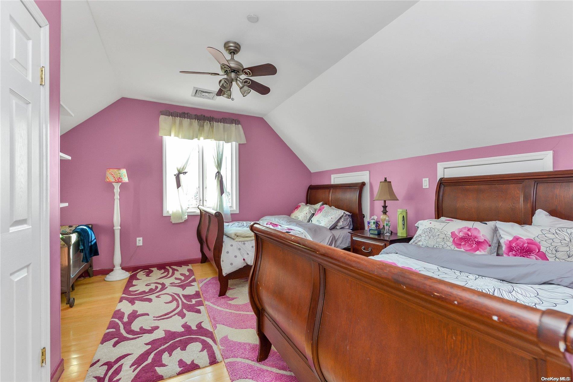 147-32 69th Road Queens, NY 11367 - Photo 14 of 24 a bedroom with furniture and a window