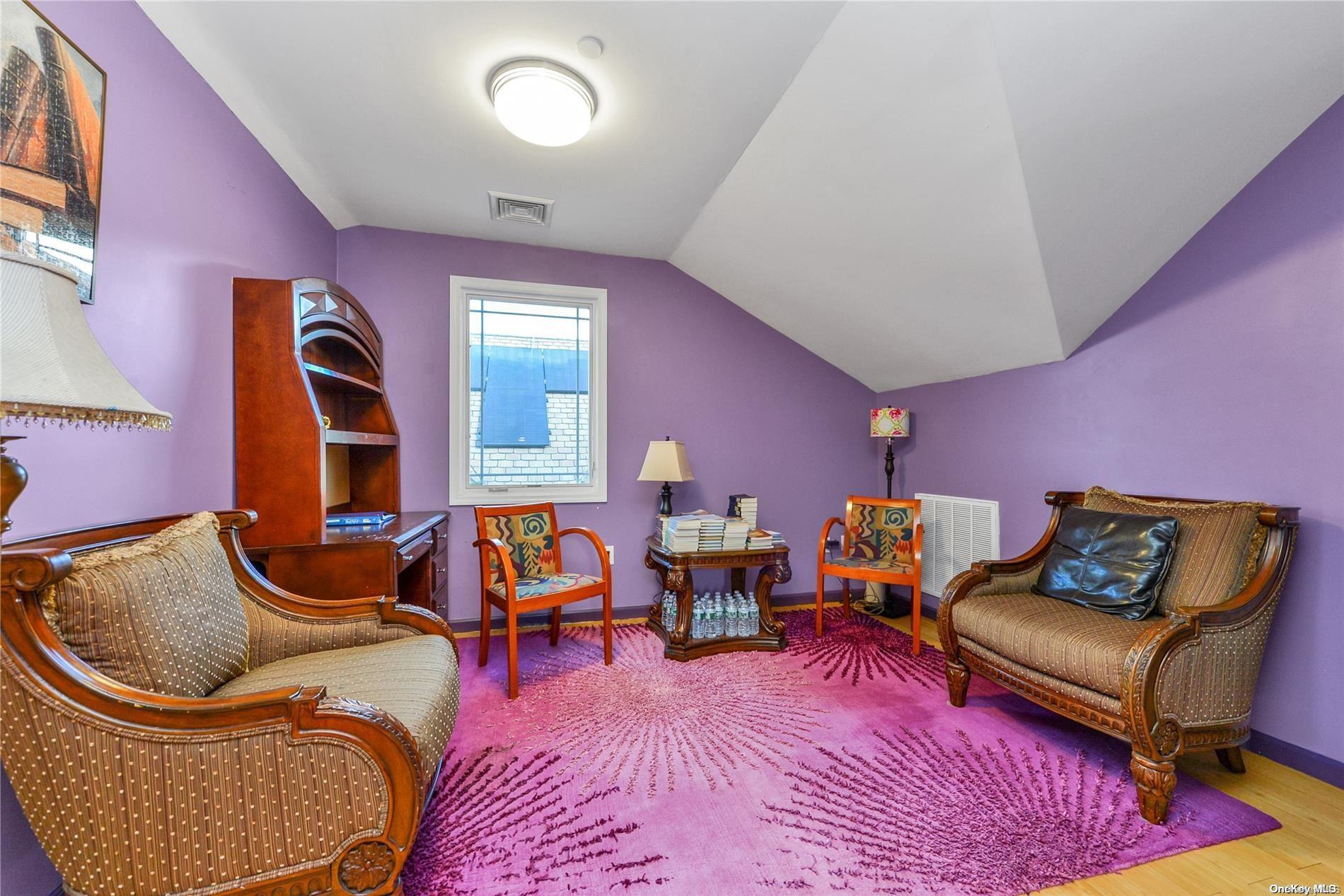 147-32 69th Road Queens, NY 11367 - Photo 16 of 24 a living room with furniture rug and wooden floor