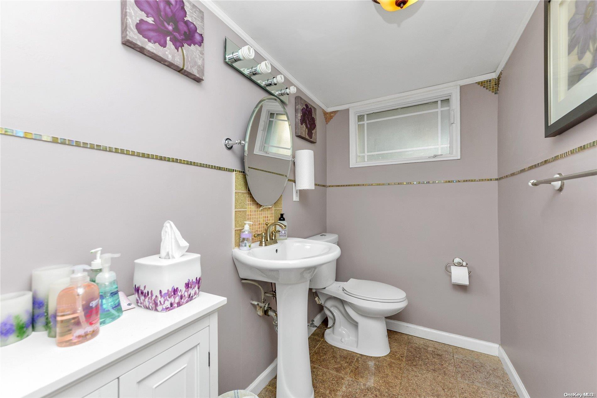 147-32 69th Road Queens, NY 11367 - Photo 19 of 24 a bathroom with a sink mirror and toilet