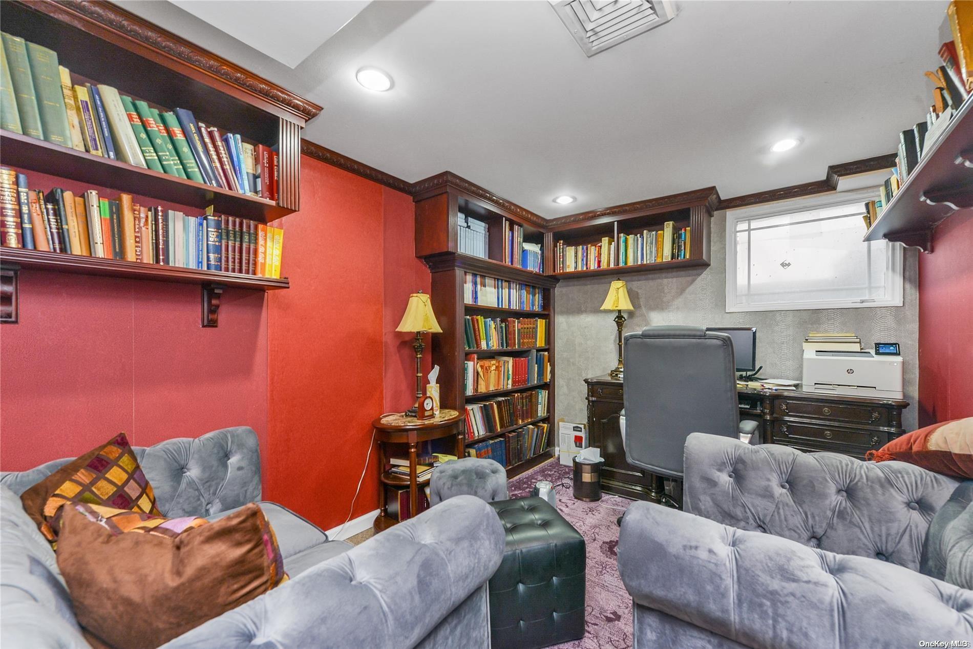 147-32 69th Road Queens, NY 11367 - Photo 21 of 24 a living room with furniture a book shelf and a book shelf