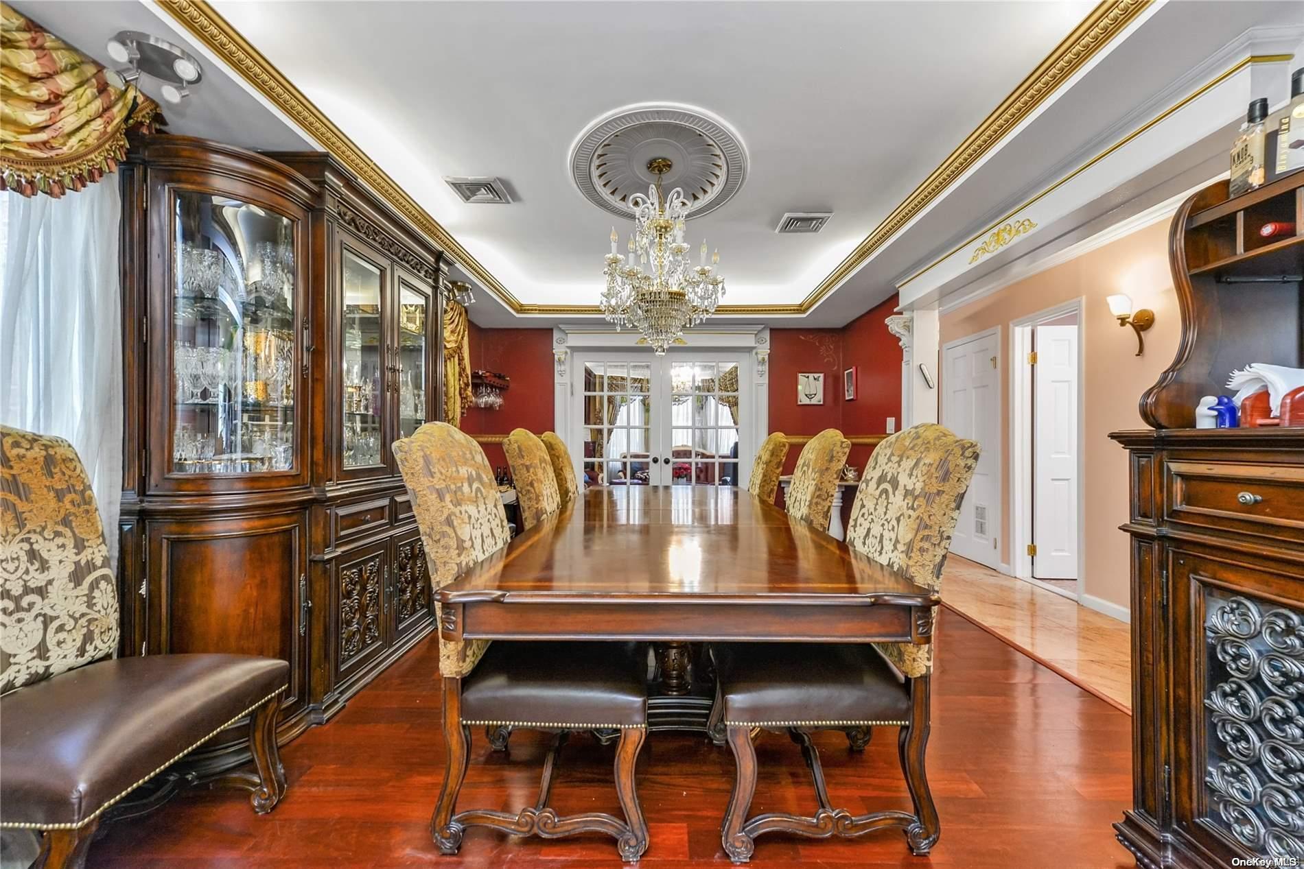 147-32 69th Road Queens, NY 11367 - Photo 4 of 24 a view of a dining room with furniture a chandelier and wooden floor