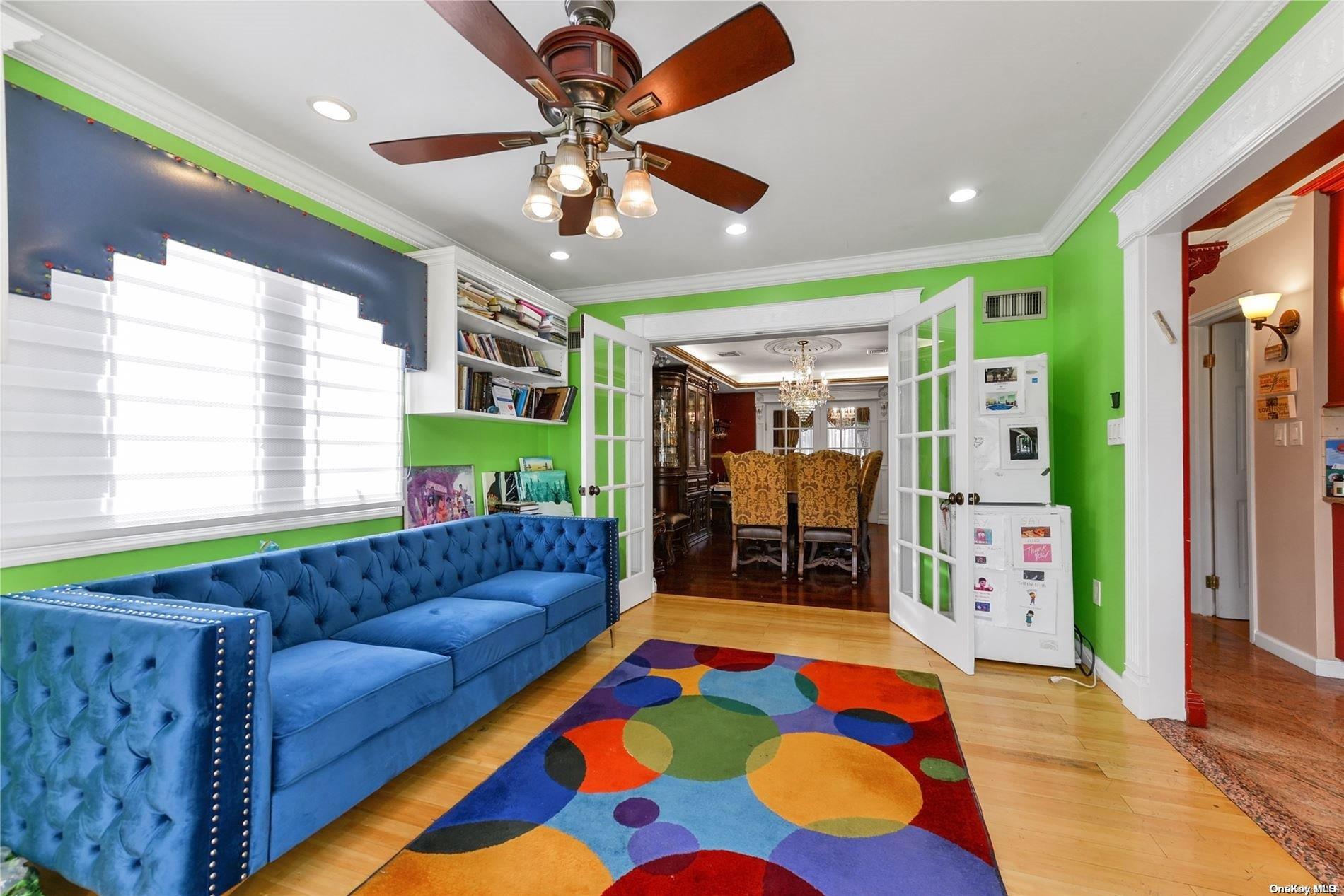 147-32 69th Road Queens, NY 11367 - Photo 6 of 24 a living room filled with furniture and a rug