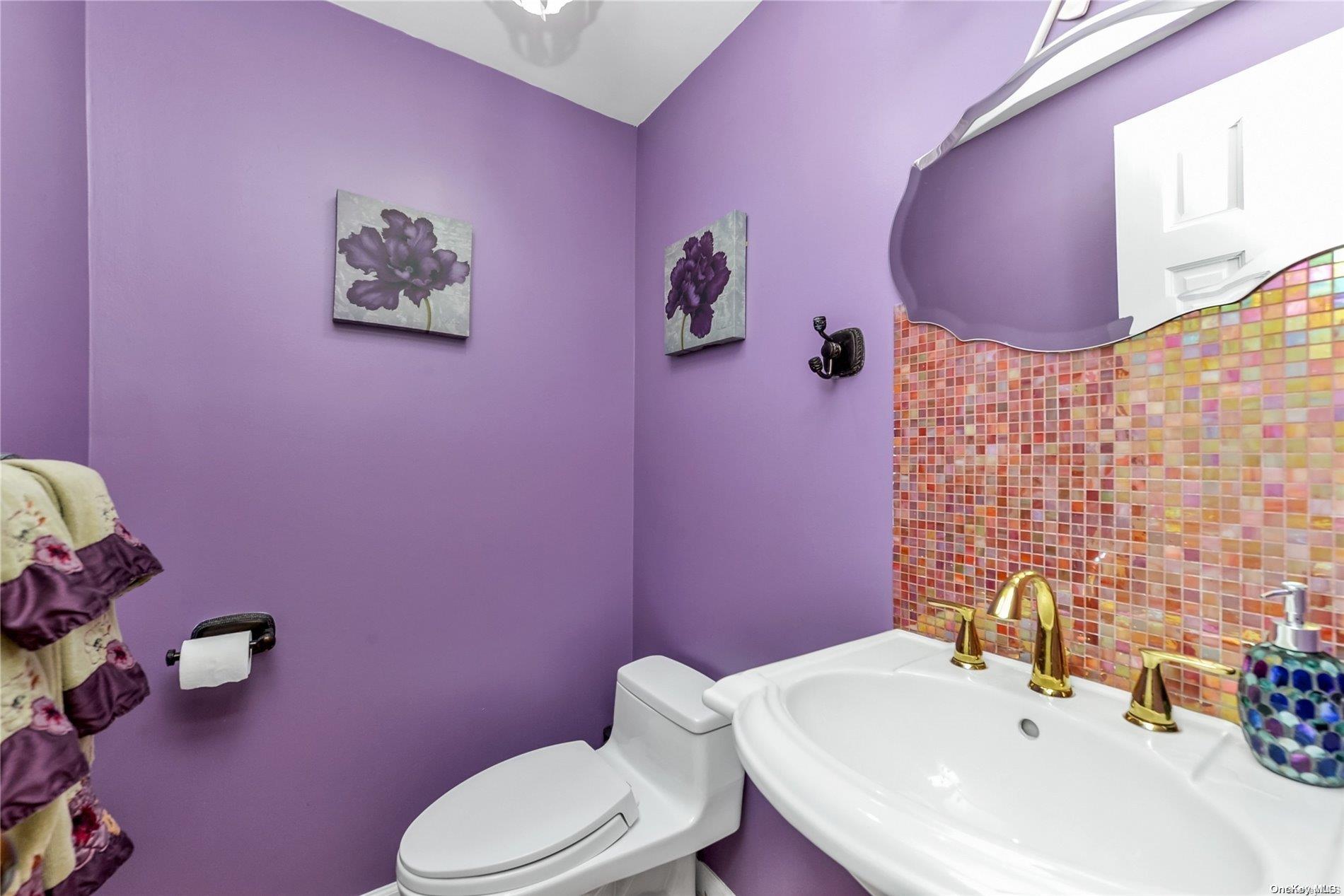 147-32 69th Road Queens, NY 11367 - Photo 8 of 24 a bathroom with a sink a toilet and mirror