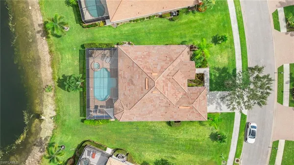 an aerial view of multiple houses with yard