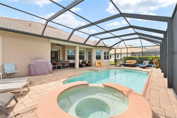 a view of a swimming pool with a patio