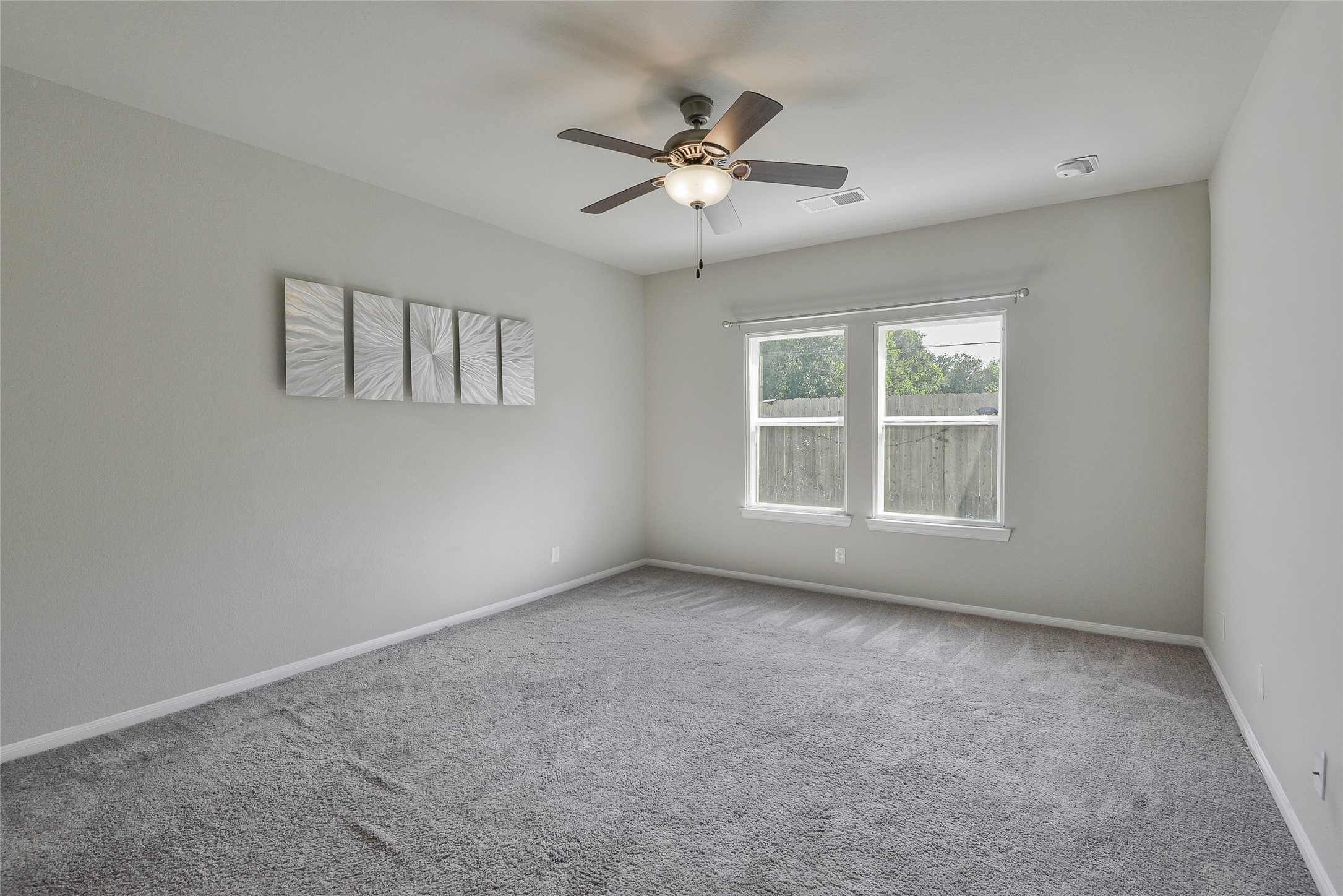614 Pequin Road Crosby, TX 77532 - Photo 17 of 43 an empty room with window and ceiling fan