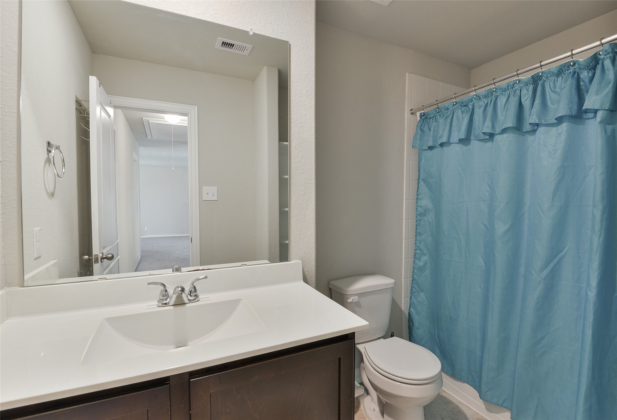 614 Pequin Road Crosby, TX 77532 - Photo 31 of 43 a bathroom with a sink a toilet a mirror and vanity