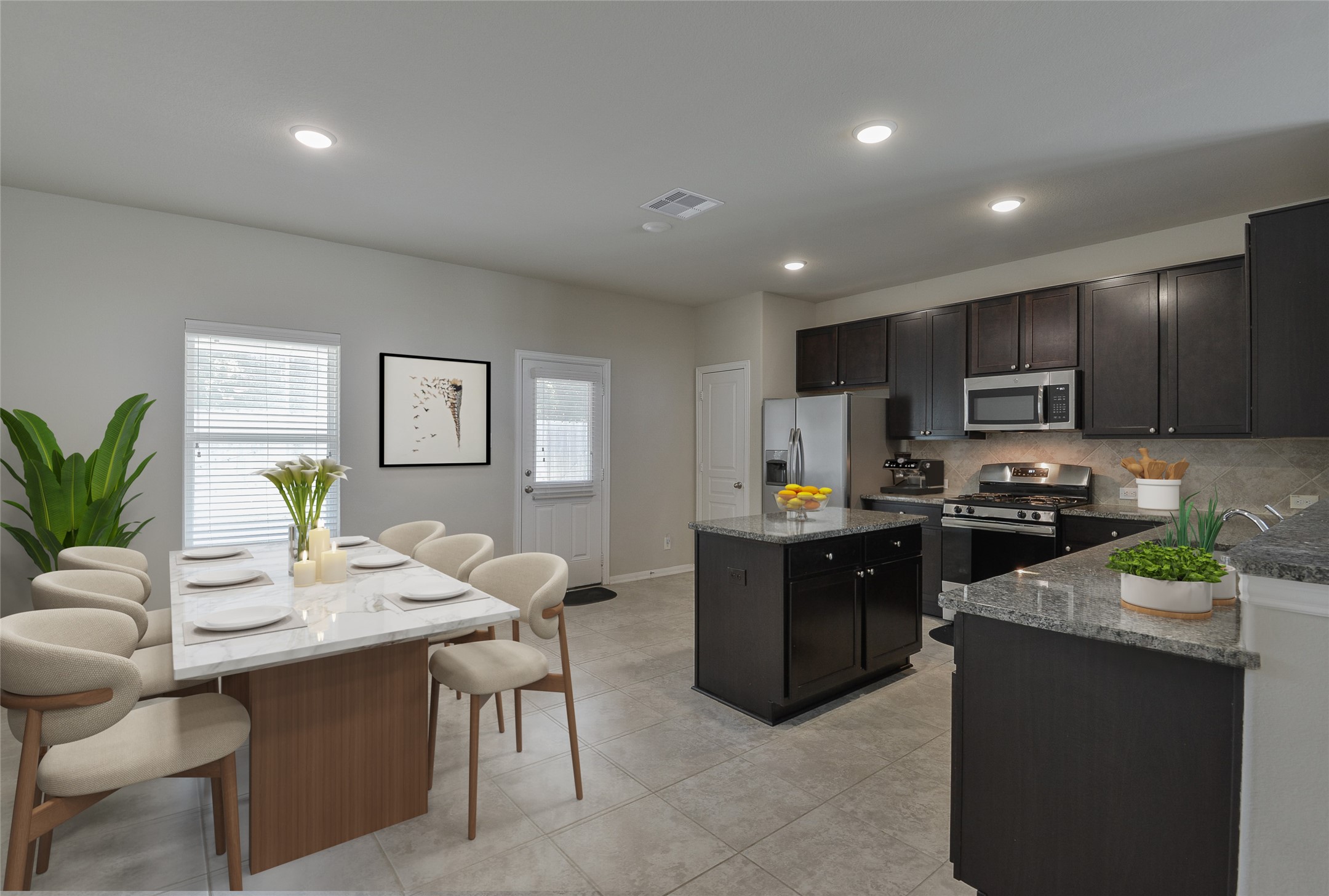 614 Pequin Road Crosby, TX 77532 - Photo 10 of 43 a kitchen with kitchen island granite countertop a sink and stove