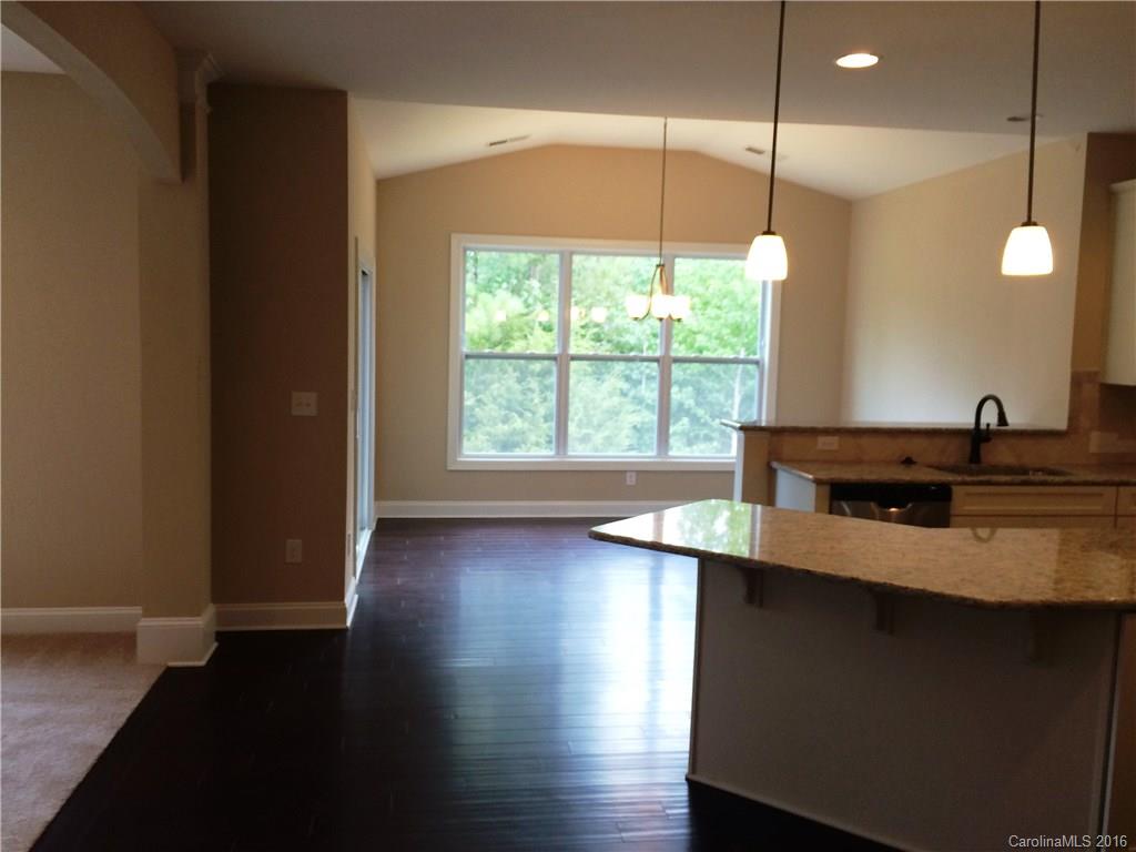 160 Kentmere Lane, Unit 81 Clover, SC 29710 - Photo 11 of 24 a kitchen with a sink a window and wooden floor