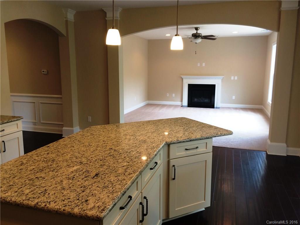 160 Kentmere Lane, Unit 81 Clover, SC 29710 - Photo 14 of 24 a kitchen with a stove and a fireplace