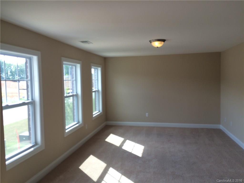 160 Kentmere Lane, Unit 81 Clover, SC 29710 - Photo 20 of 24 wooden floor in an empty room with a window