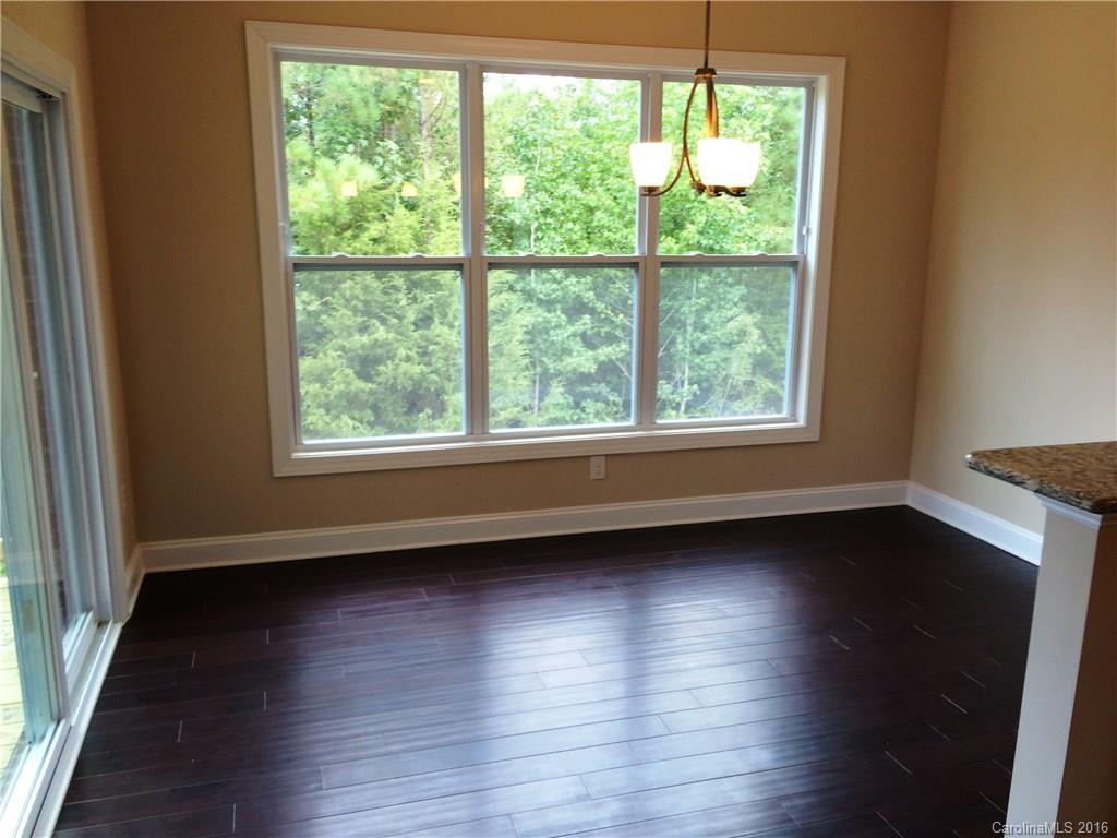 160 Kentmere Lane, Unit 81 Clover, SC 29710 - Photo 9 of 24 a view of an empty room with wooden floor and a window