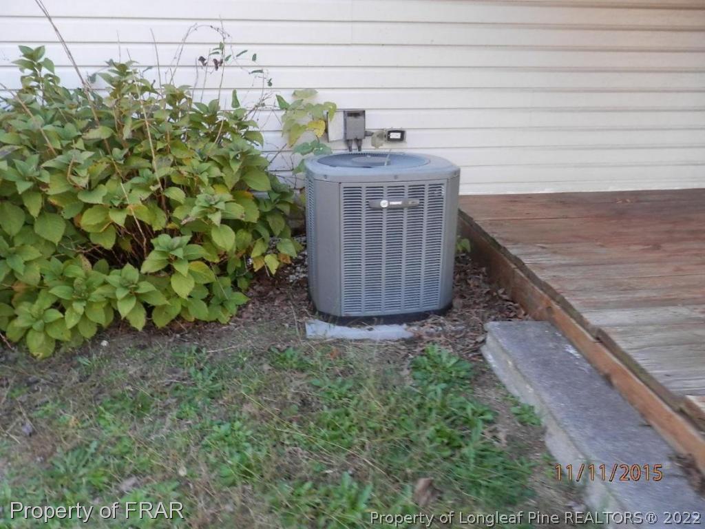 5910 Spinner Road Hope Mills, NC 28348 - Photo 5 of 12 a view of a dry yard with wooden fence